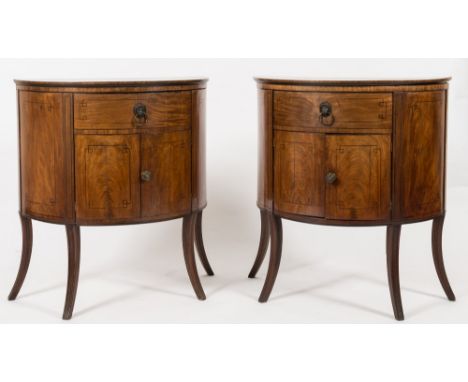 A pair of Regency mahogany and inlaid half round enclosed washstands:, bordered with ebonised lines, the hinged tops each enc