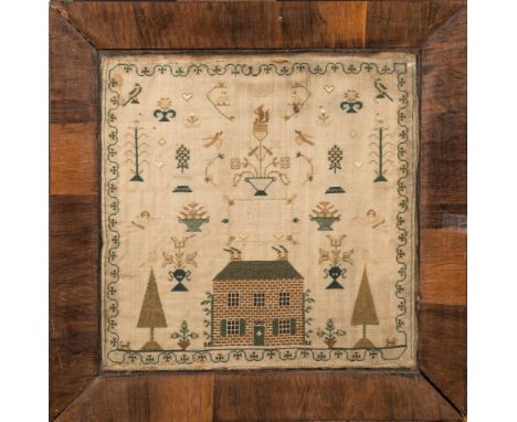 An early 19th century child's needlework sampler: by 'Eliza Bell, Her Work In The Year 1831', worked with a red brick house, 
