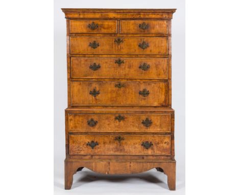 An antique walnut veneer tallboy: in two parts, the upper part with a moulded cornice, containing two short and three long cr