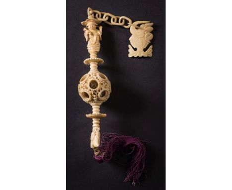 A 19th century Cantonese ivory puzzle ball suspension:, with carved fish hook, chain and figural handle, with six ring puzzle