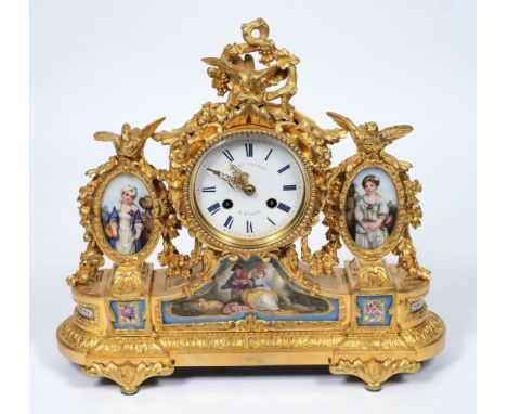Levy Frères à Paris, a gilt and porcelain mantel clock: the eight-day duration movement striking the hours and half-hours on 