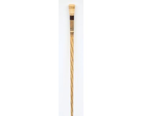 A carved marine ivory and bone walking stick:, with octagonal tapering handle, with chequered decoration, on a spiral twist d