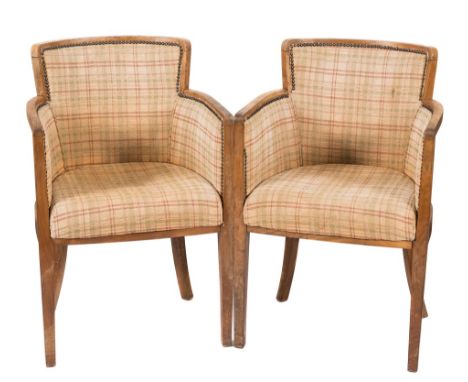 Heals - A set of four light oak club armchairs:, the tub-shaped frames each with a raised upholstered back and stuff over sea