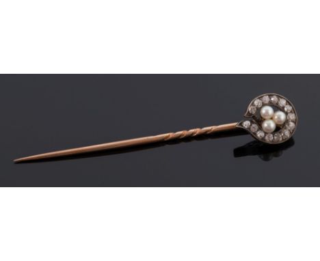 A diamond and seed-peal set stick-pin: with central trefoil cluster of seed-pearls within a surround of old brilliant-cut dia