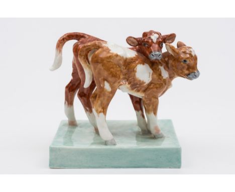 A Royal Worcester figure 'Calves' modelled by Doris Lindner: the two calves standing on a rectangular green base, printed gre