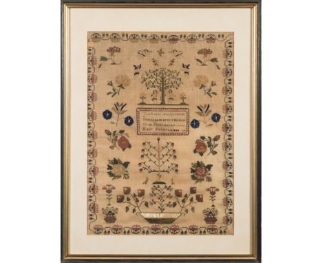 A mid 19th century petit point sampler: with central verse enclosed by traditional designs of Adam & Eve, birds, animals ange
