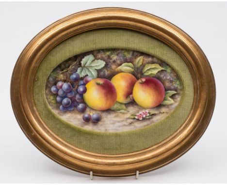 A porcelain plaque in the Royal Worcester manner: of oval form painted by Bryan Cox with apples, blossom and grapes on a moss