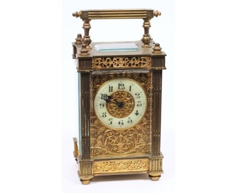 An Edwardian French brass carriage clock with filigree panels: the eight-day duration timepiece movement having a platform cy