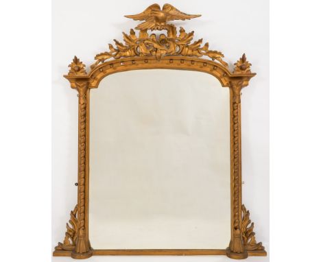 A Victorian carved giltwood and gesso domed overmantel mirror:, with pierced oak leaf and acorn cresting surmounted by a figu