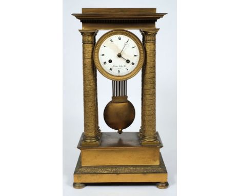 Gaston Jolly Fils à Paris, a brass portico clock: the eight-day duration movement striking the hours and half-hours on a bell