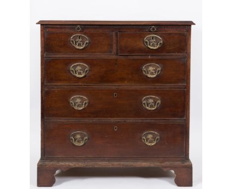 A George III mahogany rectangular chest:, the top with a moulded edge, fitted with a brushing slide and containing two short 