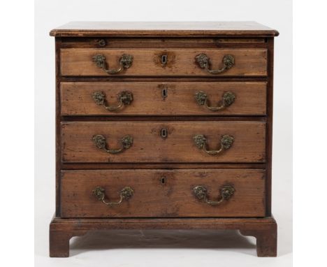 A mid 18th Century mahogany chest:, of small size, the top with a moulded edge, fitted with a brushing slide and containing f