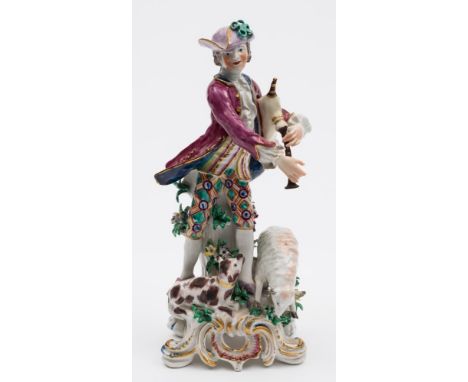 A Bow figure of a shepherd bagpiper: after the Meissen original, the figure standing with tree stump support, wearing a blue 