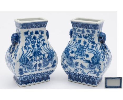 A pair of Chinese blue and white porcelain vases: of square baluster section with elephant mask and ring handles, painted fro