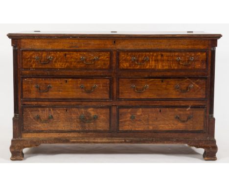 An early 19th Century oak and mahogany crossbanded rectangular mule chest:, the hinged top with moulded edge enclosing a box 