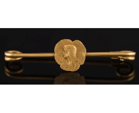 A late 19th century French gold pin brooch: with central female portrait panel.