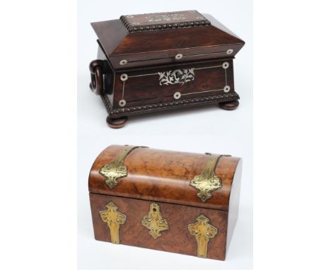 A small Victorian walnut and brass mounted tea caddy:, of rectangular outline, the domed hinged lid enclosing two zinc foil l