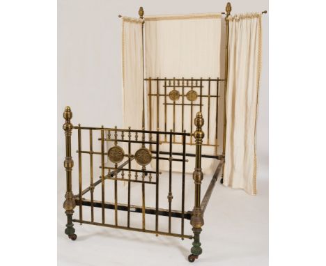 A late Victorian/Edwardian brass half tester bed:, with turned column ends and square section uprights with spindle galleries
