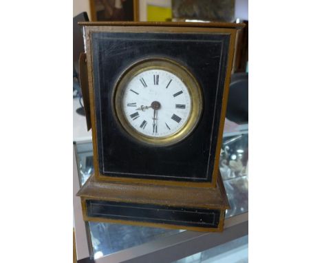 A 19th century French painted oak mantel clock, the Roman enamel dial indistinctly signed, twin-train movement, striking a go