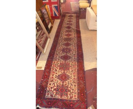 Fine North West Persian Hariz runner, repeating stylised medallion throughout the field guarded by multi stylised geometric b