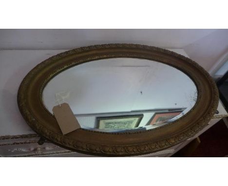 An early 20th century gilt oval mirror, with bevelled plate, 55 x 81cm 