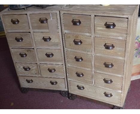 A pair of industrial style side chests, with nine drawers, raised on bracket feet, H.80 W.46 D.31cm 