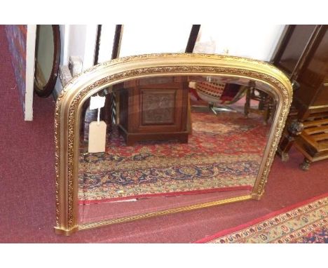 A contemporary overmantel mirror, with floral decorated frame and bevelled glass plate, H.74 W.109cm 
