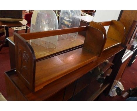 An art deco oak book trough, together with one other oak example 