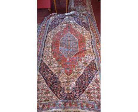 An antique Kilim carpet, with quadruple lozenge medallion, geometric design, 253 x 158cm 