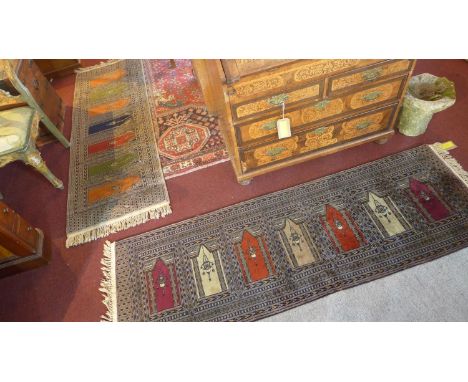 A pair of Persian runners, with geometric tile design, each signed, 183 x 63cm 