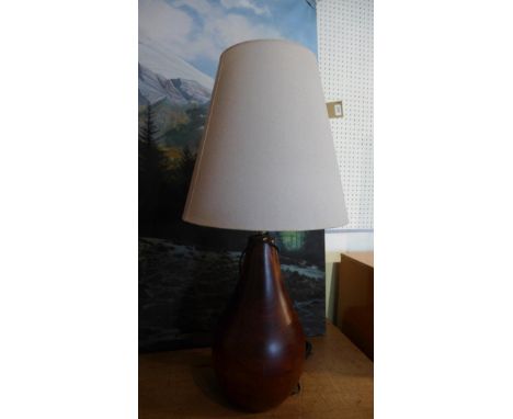 A contemporary pear shape mahogany table lamp 