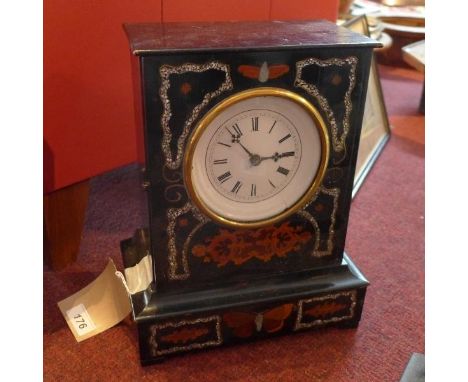 A 19th century French ebonised mantel clock, having Roman enamel dial, chiming gong, the plain ebonised case with mother of p
