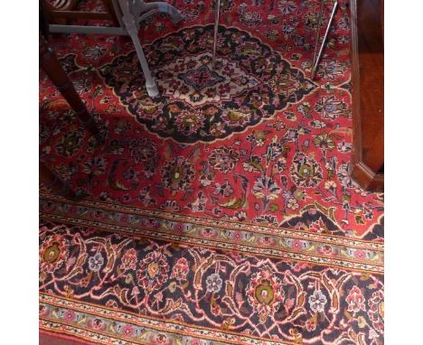 A fine Central Persian Kashan carpet, central double pendent medallion with repeating spandrels on a rouge field within styli