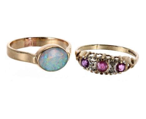 14ct opal gold backed single stone ring, 2.8gm, ring size N/O; also a 9ct ruby and diamond ring, 1.7gm (2) 