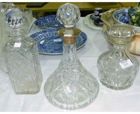 A ship's crystal decanter with silver rim; 2 other decanters
