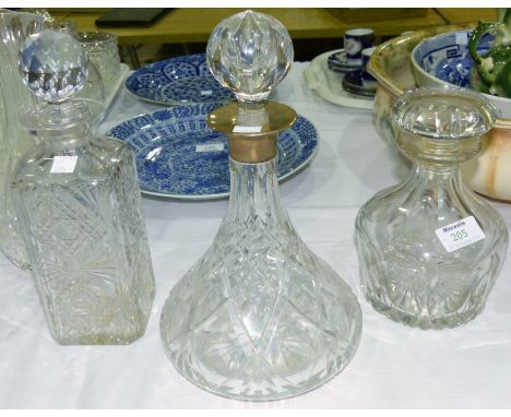 A ship's crystal decanter with silver rim; 2 other decanters