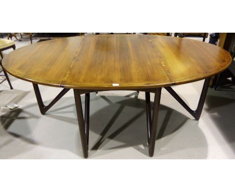 A mid-20th century rosewood dining table by Kurt Ostervig for Jason Mobler with drop leaves and integrated hinges, 'V' shaped