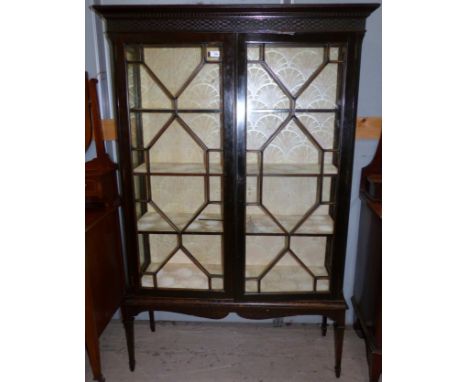 An early 20th century Chippendale style mahogany display cabinet enclosed by astragal glazed doors