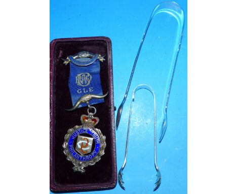 A pair of Georgian silver sugar tongs; another pair; an Order of Buffaloes silver medallion, cased