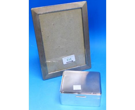 A silver engine turned rectangular photo frame; a silver rectangular cigarette box