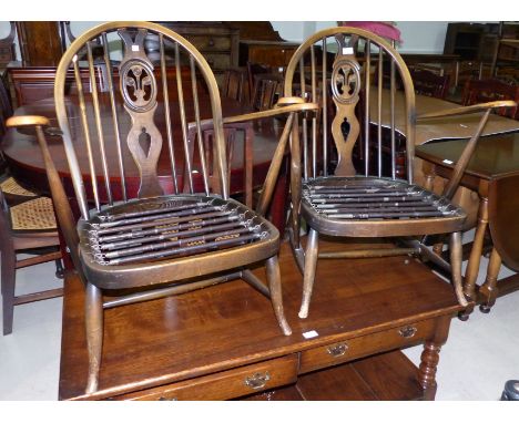 A pair of Ercol low seat stick back armchairs (frames only)