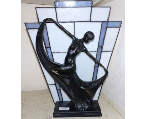 An Art Deco style figure/table lamp in the form of a dancing woman, with leaded glass shade