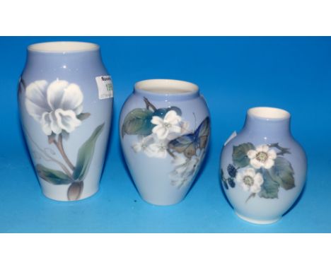 Three Royal Copenhagen vases decorated with blossom against a light blue ground, heights 6", 4¾" & 4"