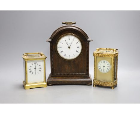 Two French brass carriage timepieces and an oak mantel clock,tallest carriage clock 12 cms high.