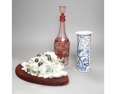An etched ruby glass decanter, a Chinese blue and white sleeve vase and a continental ceramic basket wall pocket- decanter 34