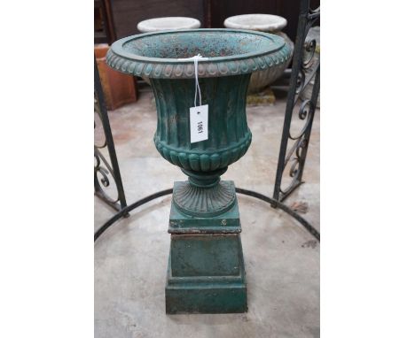 A Victorian painted cast iron campana garden urn on square pedestal stand, diameter 40cm, height 80cm