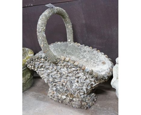 A pebble encrusted reconstituted stone basket garden planter, width 76cm, height 76cm