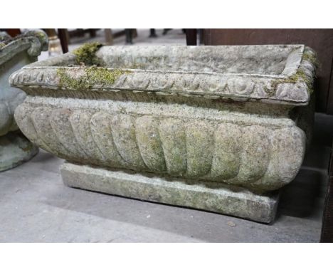 A rectangular reconstituted stone fluted garden planter, width 68cm, depth 32cm, height 36cm