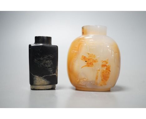 A Chinese white and black jade snuff bottle and a similar agate snuff bottle