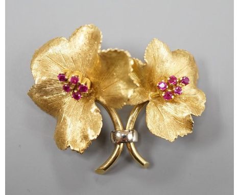 A gold and ruby cluster set double flower head brooch, indistinctly signed, 4cm, gross weight 12.5 grams.